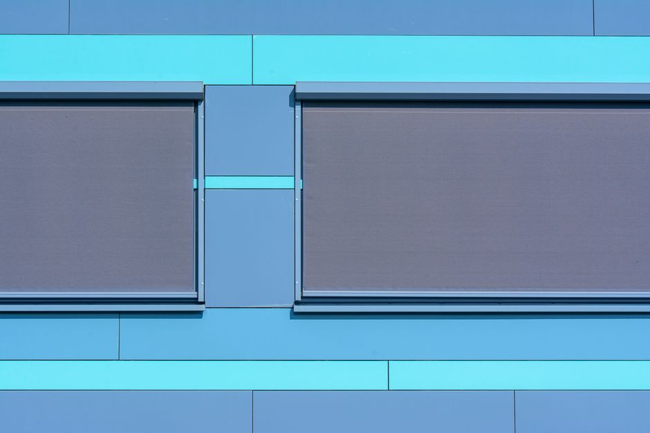 Modern roller shades installed in a bright living room